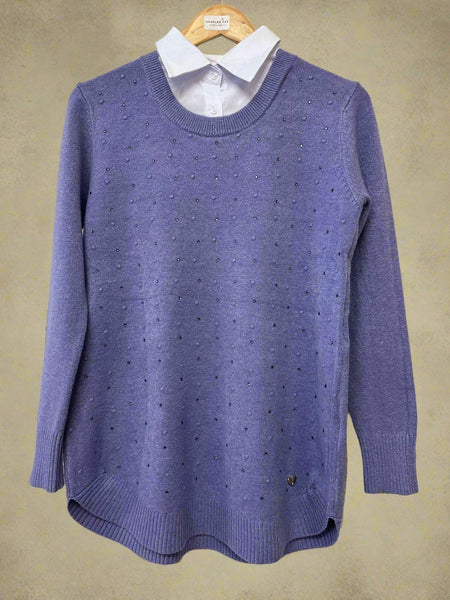 Purple sweater on a hanger with a white shirt underneath
