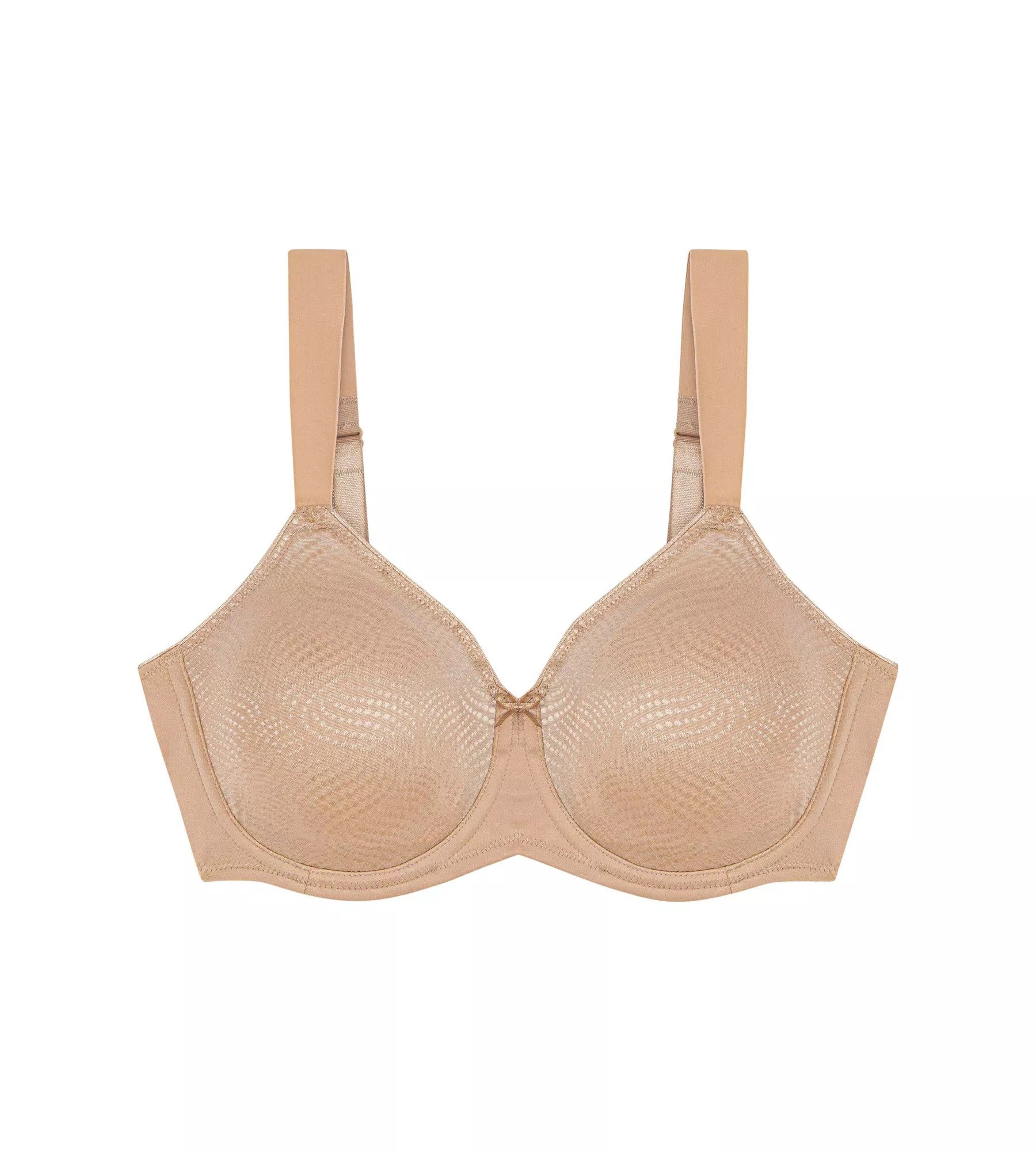 A woman wearing a beige Triumph minimizer bra with adjustable straps.